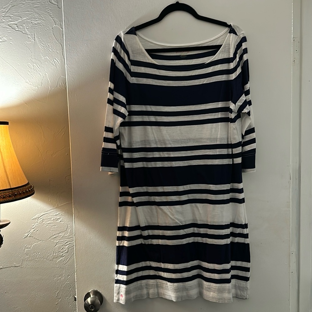 Well worn dress but still in good condition. Perfect pool coverup.